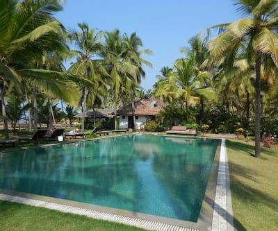 https://imgcld.yatra.com/ytimages/image/upload/t_hotel_yatra_city_desktop/v1431956139/Domestic Hotels/Hotels_Bekal/Kanan Beach Resort/Pool.jpg